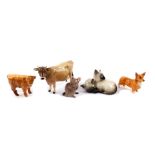 A Beswick pottery figure of a Jersey cow, Ch Newton Tickle, together with a Highland calf, beagle,