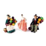 Three Royal Doulton figures, comprising The Old Balloon Seller HN1315, The Balloon Man HN1954, and