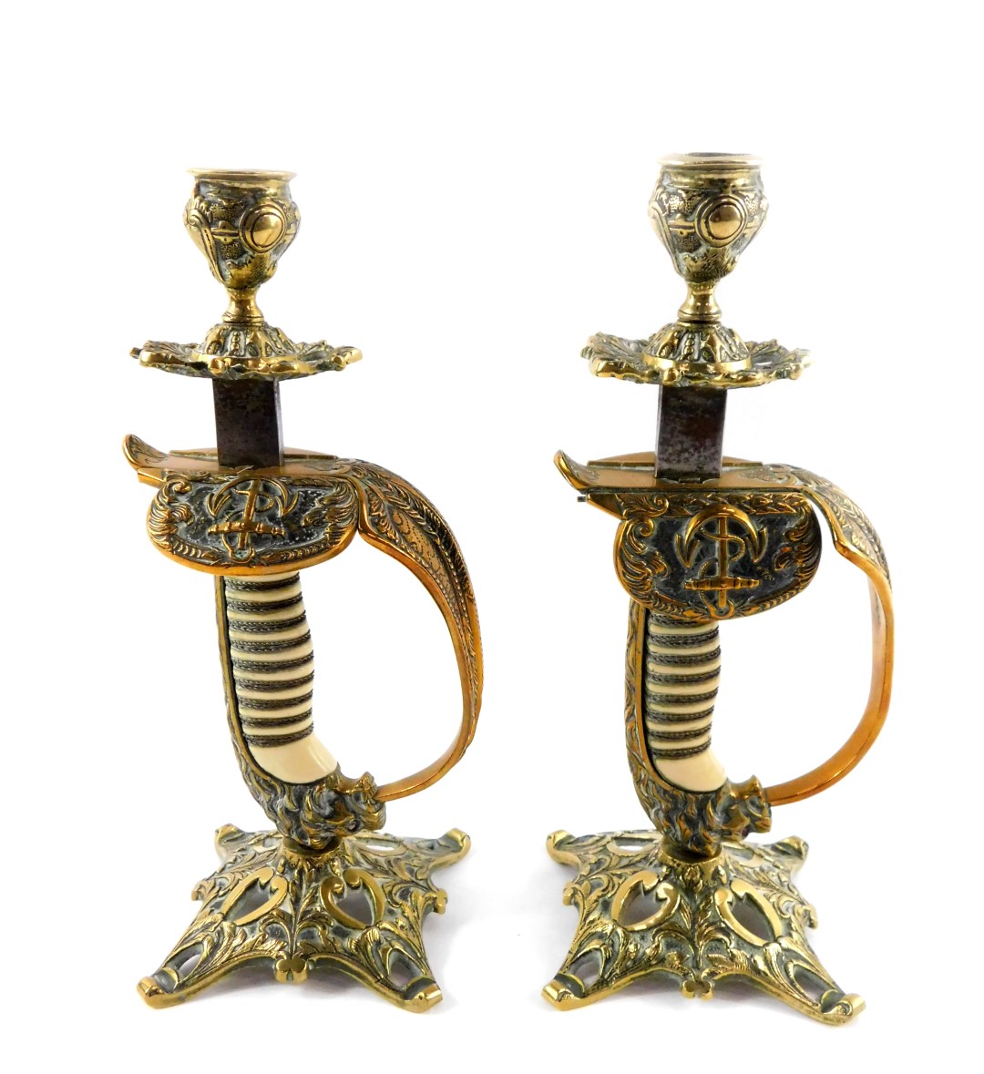 A pair of German WWI period naval sword hilt candlesticks, brass cast with wire bound grip and