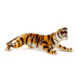A 20thC Italian pottery figure of a tiger, modelled in stalking pose with open mouth, printed marks,