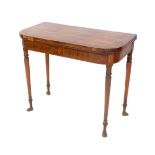 A Regency rosewood and yew wood cross banded demi-lune fold over card table, raised on turned