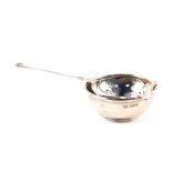 A silver tea strainer and slop bowl, Sheffield 1965, 2.93oz.