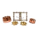 Two Victorian copper mousse or jelly moulds, 16cm and 10cm W, a pair of brass ash trays cast with