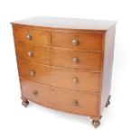 A Victorian mahogany bow front chest of drawers, with two short over three long drawers, raised on