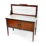 An Edwardian mahogany and line inlaid washstand, with a white marble inset splash back and top,