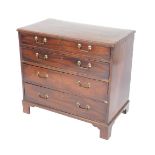 A George III mahogany chest of drawers, with four long graduated drawers, raised on bracket feet,