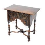 A 17thC style oak side table, with two frieze drawers, above a recessed apron, raised on turned legs