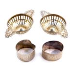 A pair of Victorian silver circular sweetmeat dishes, of pierced handled quaich form, Goldsmiths and
