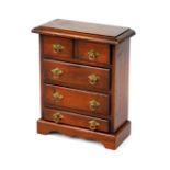 A mahogany and pine apprentice style chest of drawers, with two short over three long drawers,
