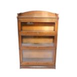 A Victorian oak Lebus bookcase, three section with a galleried top above three glass fronted up