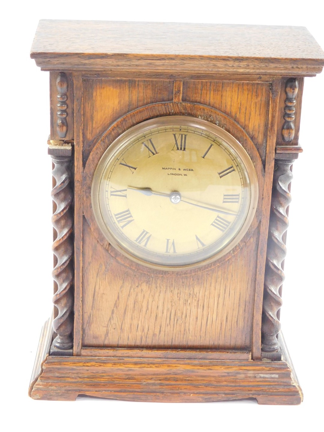 A early 20thC Mappin & Webb oak cased mantel clock, circular brass dial bearing Roman numerals,