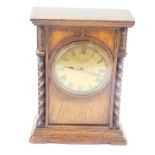 A early 20thC Mappin & Webb oak cased mantel clock, circular brass dial bearing Roman numerals,