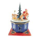 A mid 20thC Steinbach Christmas carousel, playing Stille Nacht and O Tannenbaum, the carousel