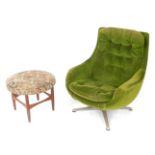 A 1960s/1970's swivel egg chair, probably Parker Knoll, upholstered in green buttoned back fabric,