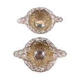 A pair of Victorian silver quaich sweetmeat dishes, with pierced and embossed floral and foliate