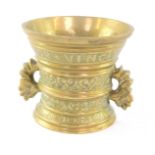 A Continental polished bronze pestle and mortar, "Amor Vincit Omnia 1771", Love Conquers All, 11cm H