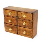 A pine and stained wood spice chest, of six drawers, in a rectangular casing, 37cm H, 47cm W, 16cm