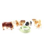 A Melba ware pottery figure of a bull, together with a Jersey cow, calf, Pekingese dog, and a