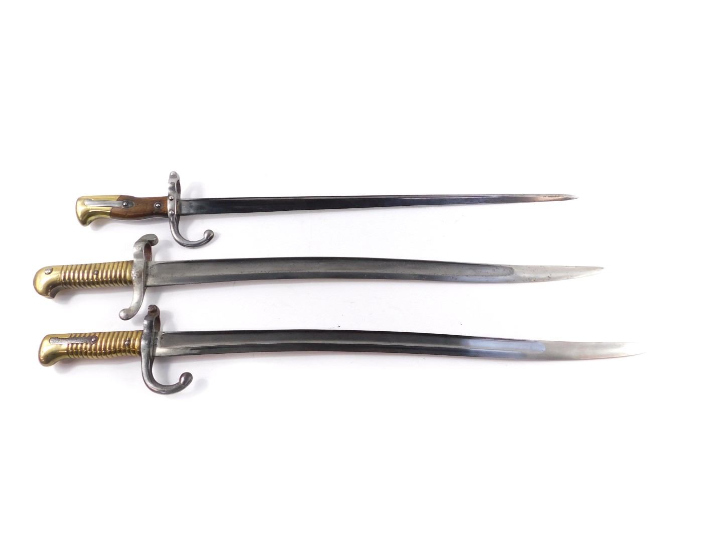 A late 19thC French Chassepot bayonet, together with a St Etienne bayonet 1871, and a further