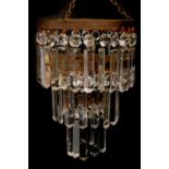 A brass framed three tier waterfall chandelier, with cut glass drops, 31cm H, 20cm dia.