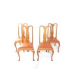 A set of four Queen Anne style oak single dining chairs, with vase shaped splats, leatherette drop-