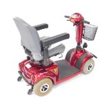 An Invacare Taurus mobility scooter, red.