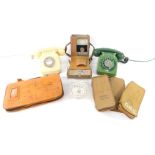 A British Telecom cream dial telephone, green two tone telephone, GPO and telecom wallets.