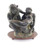 A late 19thC Continental bronze figure group of Pan and Diana, modelled in seated entwined pose,
