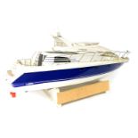 A kit built Robbie Najade remote control model speed boat, white and blue body, with Planet