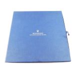 A Maserati hard bound catalogue, in a blue slip case - Maserati Excellence Through Passion, signed