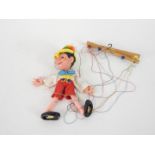 A Pelham Puppet Pinocchio puppet, boxed.