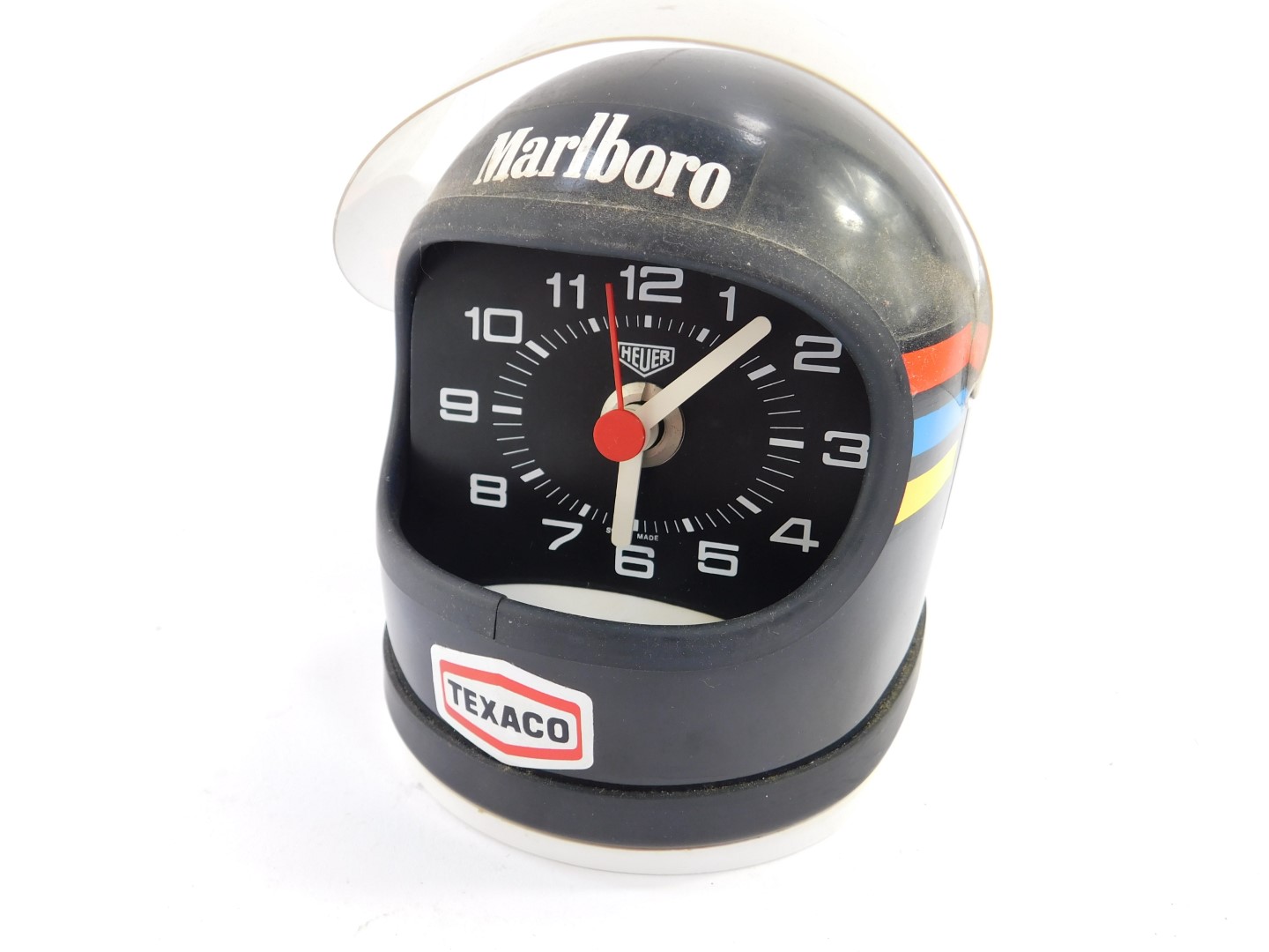 A Heuer desk clock modelled as James Hunt's helmet, black with decals, battery operated. - Image 2 of 2