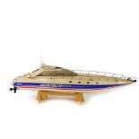 A kit built Robbie Montega 75 remote control model speed boat, white body with blue and red