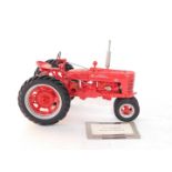 A Franklin Mint Precision Models die cast Farmall Model H tractor, 1:12 scale, red, with certificate