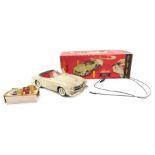 A Schuco 2095 tinplate clockwork remote control Mercedes-Benz 190sl, cream body and red plastic