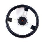 A Mountney Motor Products steering wheel, with steering wheel boss and stitched leather grip, 33cm