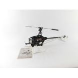 A kit built Thunder Tiger Raptor 30 Class Nitro RC helicopter, with manual, lacking plastic body and