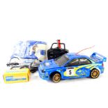 A Bycmo Subaru remote controlled car, with remote, parts, etc.