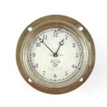 A Smiths 8-day car dashboard clock, with silvered dial bearing Arabic numerals, 11cm Dia.