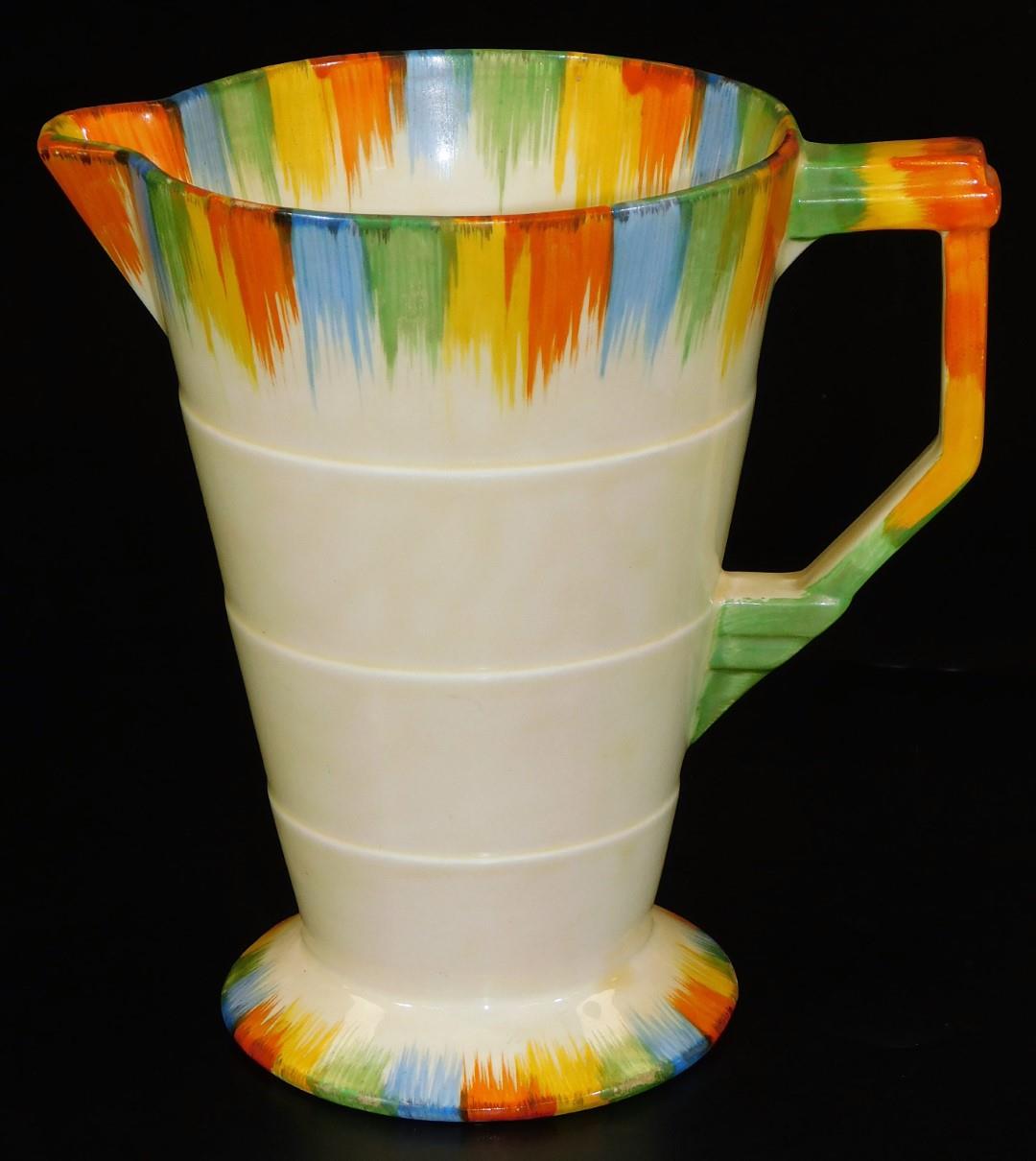 A mid 20thC Grindley Art Deco pottery jug, with splash decoration predominately in green, yellow,