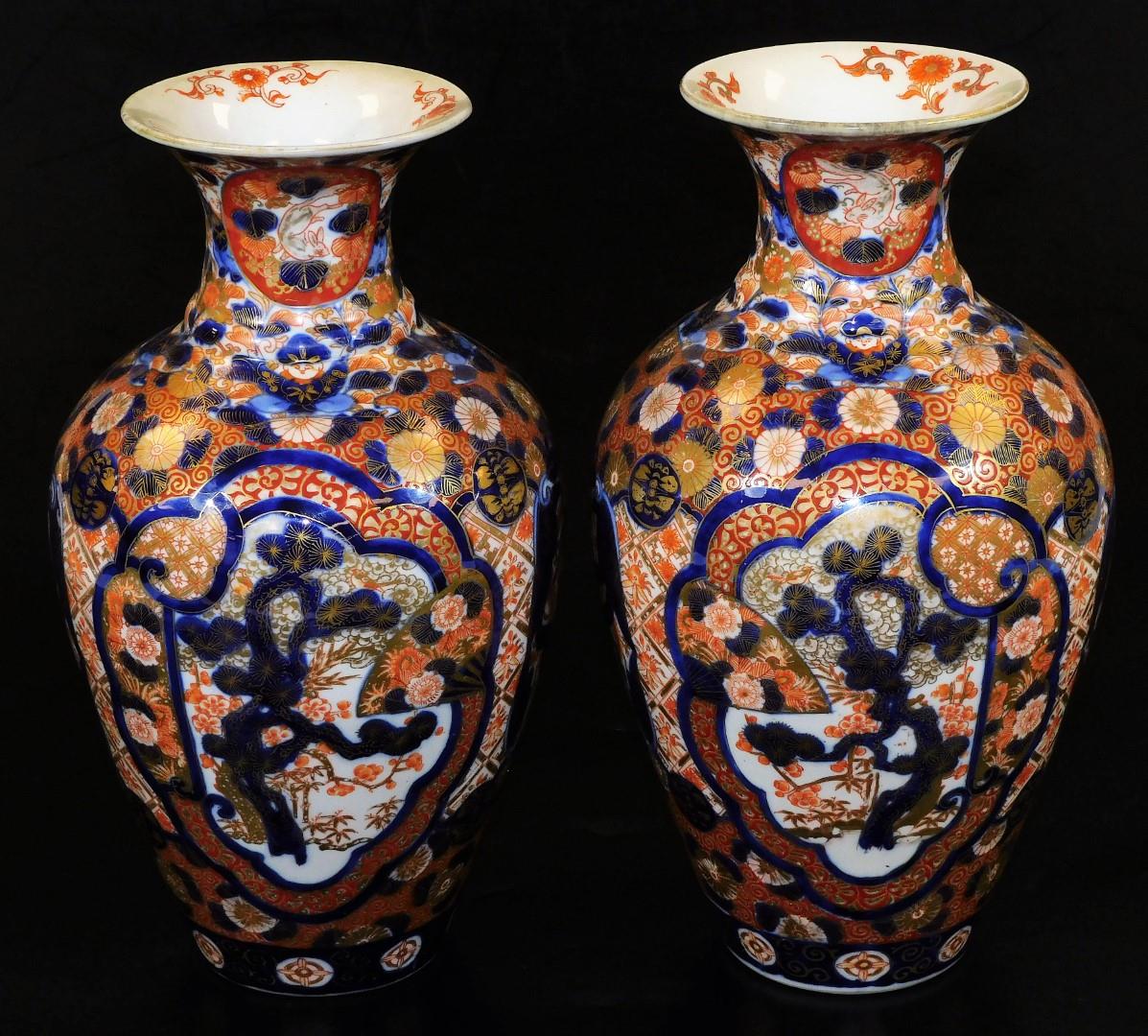 A pair of Meiji period Japanese Imari vases, each of baluster form, profusely decorated with panels, - Image 3 of 6