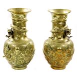A pair of Chinese bronze vases, each with cylindrical stems and shouldered circular bodies, raised