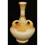 A late 19thC Royal Worcester porcelain blush ivory two handled vase, with cylindrical stem,