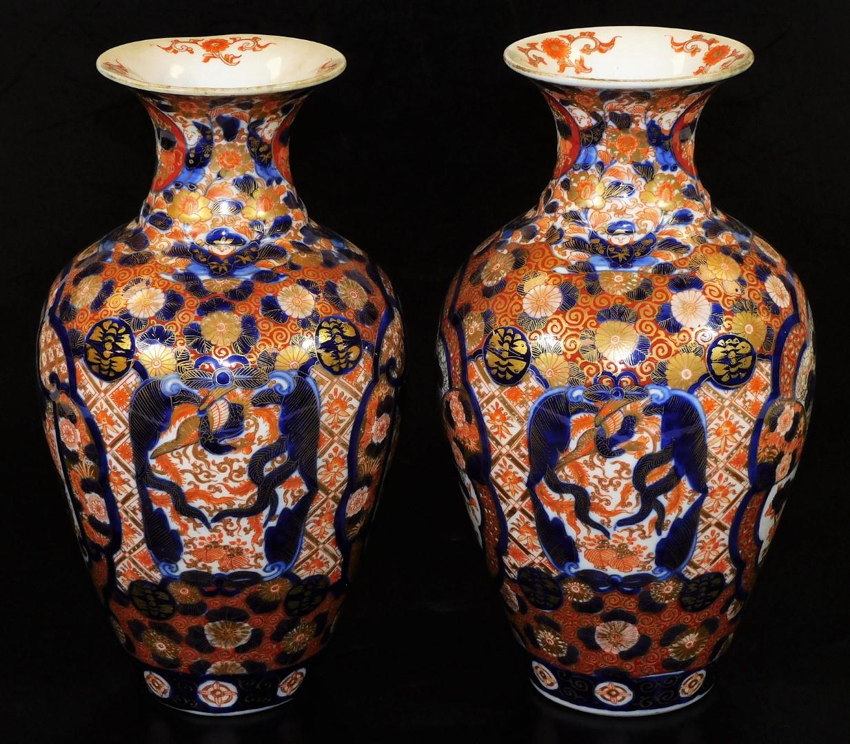 A pair of Meiji period Japanese Imari vases, each of baluster form, profusely decorated with panels, - Image 2 of 6