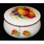 A Royal Worcester porcelain jar and cover, handpainted with autumnal fruits, blackberries and apples