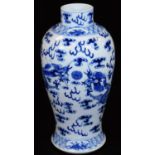 A 19thC Chinese blue and white porcelain baluster vase, decorated with four clawed dragons chasing