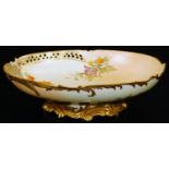 A Royal Worcester blush ivory low comport, decorated with flowers, shape code 1426, c1891, 25cm W.