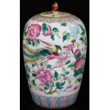 A Chinese porcelain ovoid jar and cover, decorated in famille rose palette with phoenix flying among