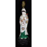 A 19thC Japanese Kutani figure of the Goddess Kannon, carrying a lotus bud, dressed in white robe,