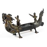 A Chinese bronze model of a boat, of dragon form set with oars man and leader, unmarked, 17cm H.